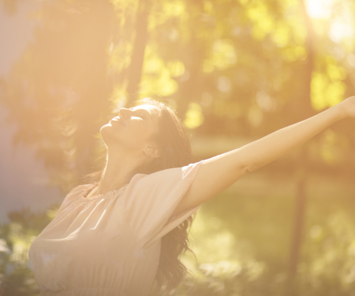 Woman enjoying the sun in a park