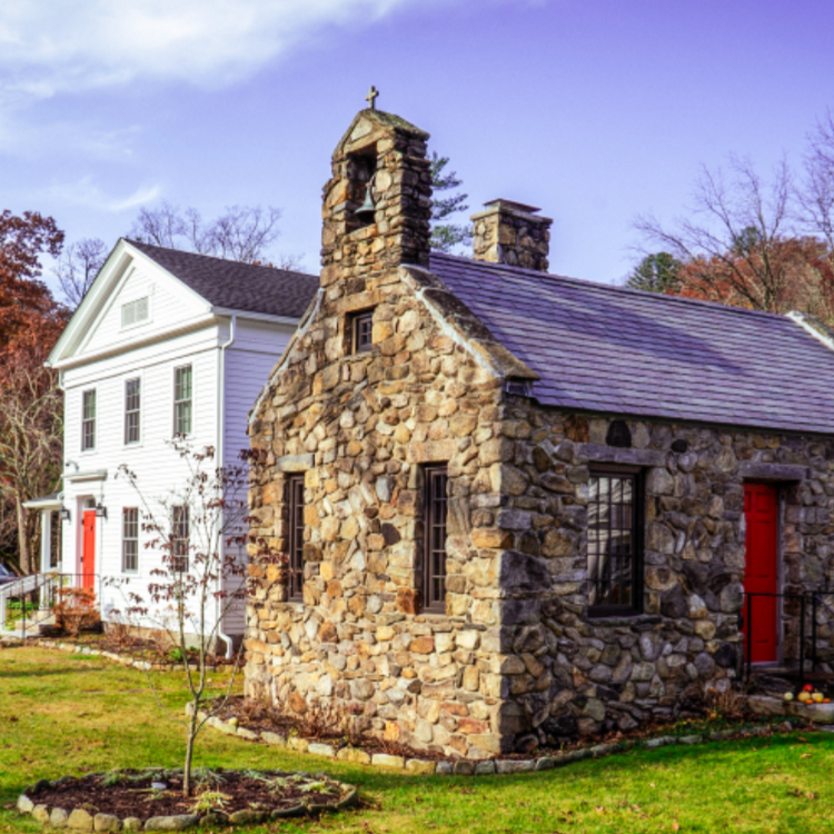 A white house and a stone house at the Trinity Retreat Center